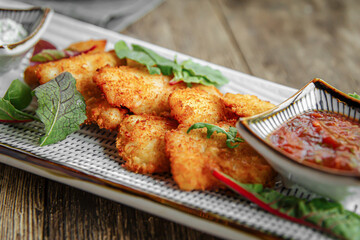 Top view on portion of gourmet chicken nuggets appetizer