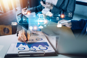 Cybersecurity and privacy concepts to protect data. Lock icon and internet network security technology. Businessman protecting personal data on smart phone with virtual screen interfaces.