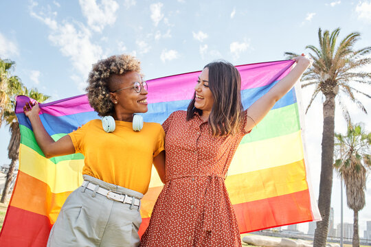 Lesbian women celebrating Pride Day. Young woman girlfriends