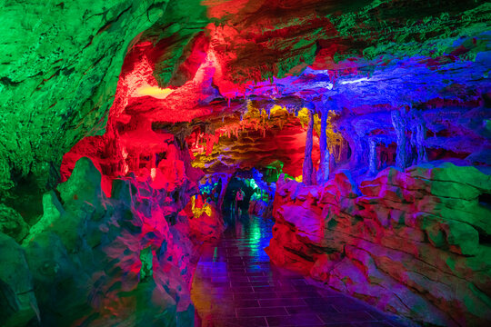 Dark lighting of the Huanglong cave, Zhangjiajie, Hunan, China. Horizontal image with copy space for text, background, green, blue, pink, purple colors