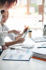 Businesswoman advisor, business people talking, planning analyze investment and marketing on tablet in office.