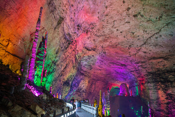 Tha passage through the halls of Huanglong limestone cave with stalactites and stalagmites with...