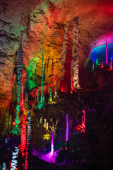 Stunning vertical columns of stalactites and stalagmites of Huanglong cave, Zhangjiajie, Hunan, China. Vertical image with copy space for text, background