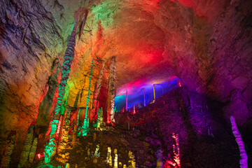 Horizontal image of the stunning vertical columns of stalactites and stalagmites of Huanglong cave,...