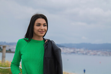 woman walking happy and relaxed through seascape