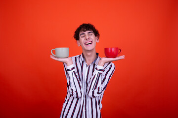 Early morning. Funny man with a hot drink.	