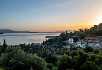 Fototapeta na wymiar A beautiful sunrise over a village in Ithaca, Greece.