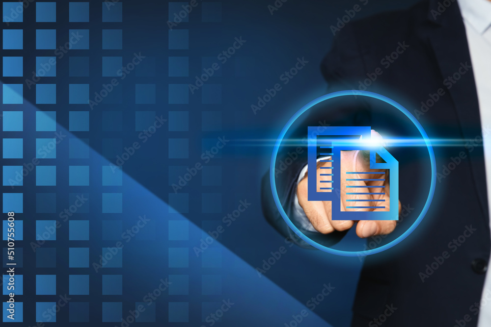 Poster man pointing at virtual icon of computer file on dark blue background, closeup