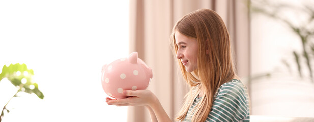 Teen girl with piggy bank at home. Banner design