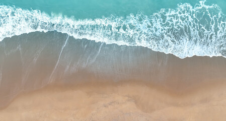 Fototapeta na wymiar Aerial Top view of Beach sand copy space Beautiful sea waves in Summer tropical background