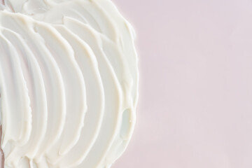 Fototapeta na wymiar Cosmetic product cream gel texture smudge on pastel beige background