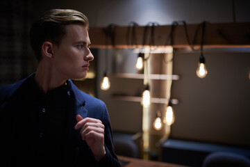 young man in cozy apartment