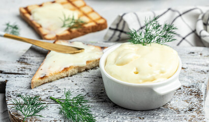 Sliced bread with cream cheese and butter for breakfast. melted cheese sandwich on light background. banner, menu, recipe place for text, top view