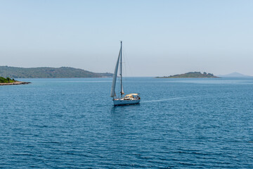 Obraz premium A sailing yacht on the Ionian Sea sailing the Greek islands. Sailing holidays.