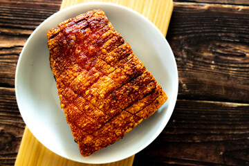 crispy pork belly on woodcutting bord