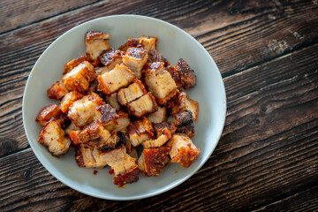 crispy pork on wooden table