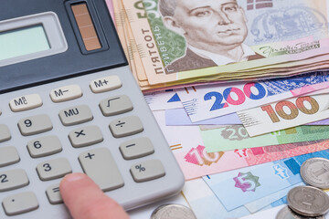 Ukrainian hryvnia and coins, background. Concept of receiving a salary, pension, inflation, deposit and credit. Concept of increasing the price of utilities, energy, gast