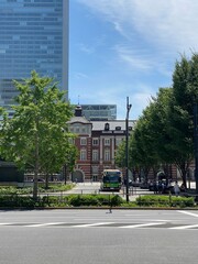 Fototapeta premium The Tokyo station square, with bus stops and modern office buildings, shot taken on year 2022 June 13th, sunny weekday