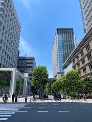 Street pedestrian&rsquo;s crossings at the Tokyo Station square, city high buildings and the environment, year 2022 June 13th, sunny weekday Japan