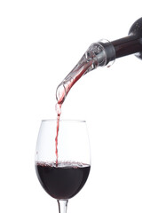 Cropped close-up shoot of red wine being poured through a transparent aerator into a glass. The bottle of wine and the glass are isolated on a white background. Front view.