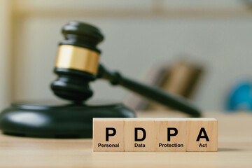 Personal Data Protection Act or PDPA concept. wooden blocks with Text PDPA on Judge gavel...