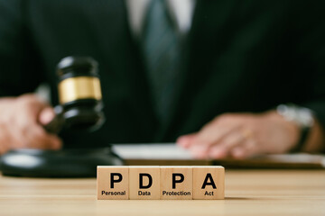 Personal Data Protection Act or PDPA concept. wooden blocks with Text PDPA on Judge gavel background represent the privacy laws of sensitive information and policies. personal data privacy policy