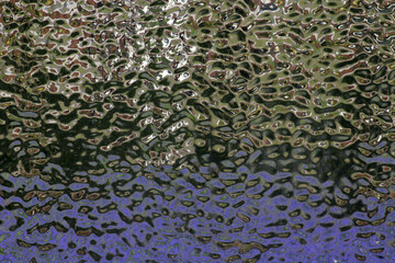 Mirrored and wavy wall surface.