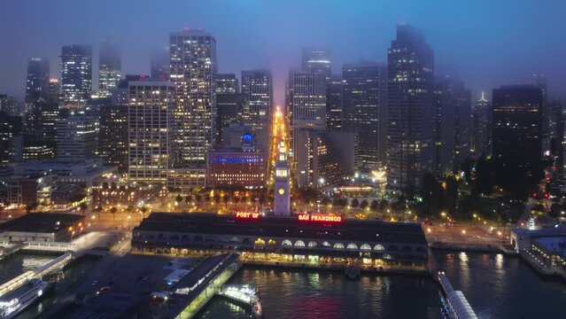 Downtown San Francisco, dark summer night city lights. Illuminated night city, USA 4K b-roll drone shot of night scene. Aerial panorama of Embarcadero and Financial District skyscrapers and buildings