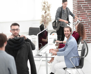 group of designers and tailors working in the Studio