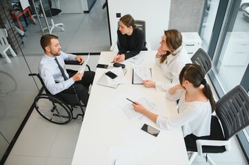 Fototapeta premium Corporate business team and in a meeting at modern office with big windows . High quality photo