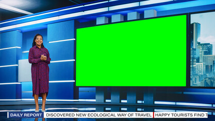 Talk Show TV Program: Beautiful Black Female Presenter Standing in Newsroom Studio, Uses Big Green Chroma Key Screen. News Achor, Host Talks About News, Weather. Mock-up Cable Channel