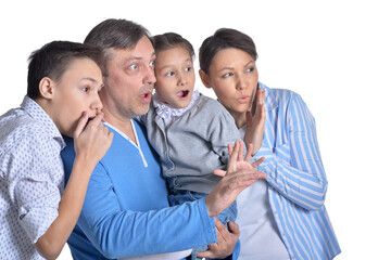 Portrait of family posing together isolated on white background