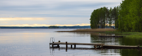 Typical Finnish little wooden shed along lake at the countryshide