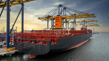 Obraz premium Aerial view container ship at terminal commercial seaport freight shipping maritime vessel, Global business supply chain import export logistic transportation oversea worldwide by container cargo.