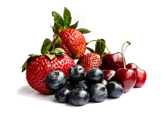 Fototapeta na wymiar Fresh strawberries, blueberries and cherry isolated on white background, fresh berries isolated on white background