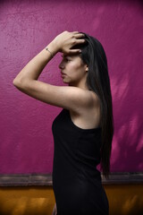 Sensual young latin woman posing in mexican town