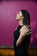 Sensual young latin woman posing in mexican town