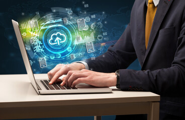 Business hand typing on a modern laptop