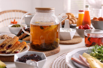 Many different dishes served on buffet table for brunch