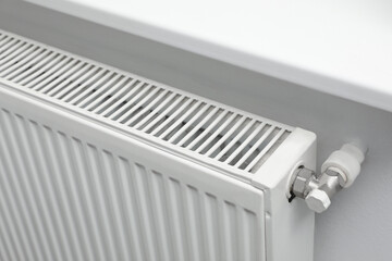 Closeup view of modern radiator. Central heating system