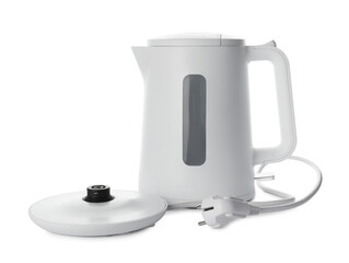 Modern electric kettle with base and plug isolated on white