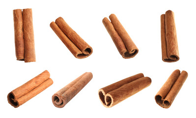 Set with aromatic cinnamon sticks on white background