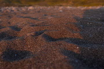 Fototapeta na wymiar Sand textures in the golden light at sunrise at the coast of Spain