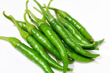 Fresh green chilli peppers isolated on white background