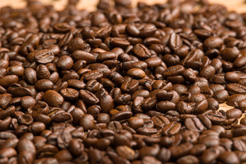 close-up of coffee beans on a wooden table