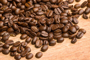 close-up of coffee beans on a wooden table