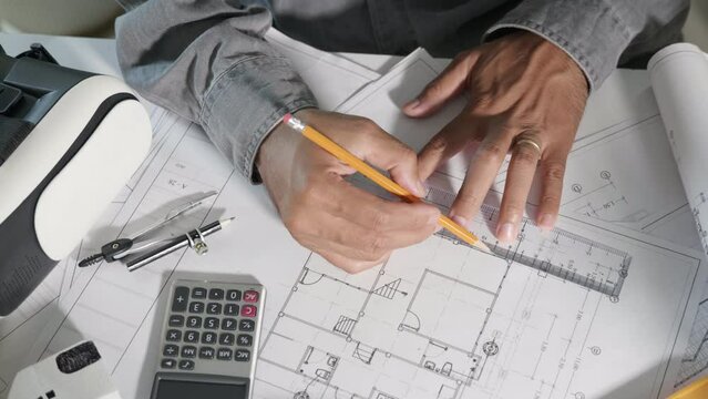 Architect workplace. Architectural building design and construction plans with blueprints paper project plans VR glasses, designing man edit a building or architecture with ruler, technology industry