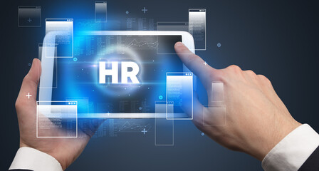 Close-up of a hand holding tablet