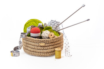 crochet jute craft basket isolated on white background, tailor and designer accessories in wicker box, zero waste storage