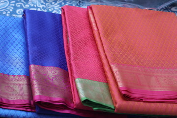 multiple varieties of handwoven silk sarees in multiple colors